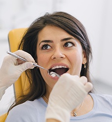 Woman getting dental exam