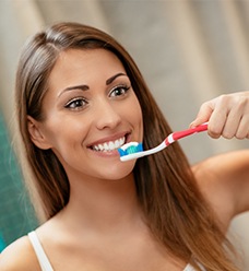 Woman brushing her teeth