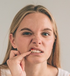 woman with red inflamed gums