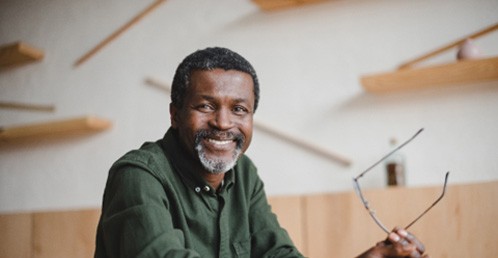 Older man smiling with dental bridge from Jacksonville Dental Specialists