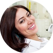 Smiling woman laying back in dental chair