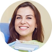 Young woman smiling showing off her dental veneers