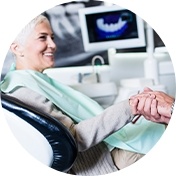 Woman shaking hands with her dentist