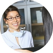 Dental team member smiling at a patient