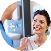 Dentist with hand on patients shoulder smiling