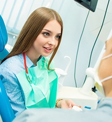 A woman at her dental checkup with a dentist in Jacksonville