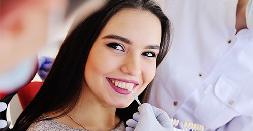Smiling woman in the dental chair visiting Jacksonville cosmetic dentist