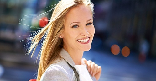 Woman smiling with dental crowns in Jacksonville