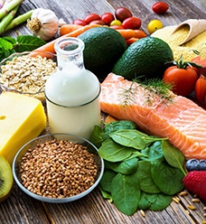 a group of nutritious foods on a wooden table