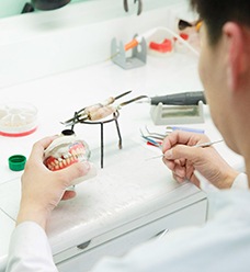 A dental technician making dentures