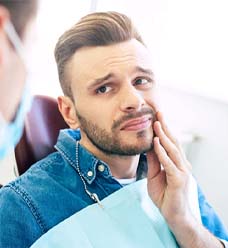 Man with toothache visiting his Jacksonville emergency dentist