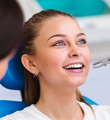 Woman receiving tooth extraction