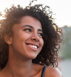 Smiling woman after gum recontouring in Jacksonville