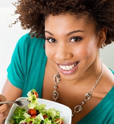 Woman eating salad