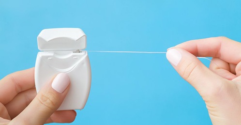 Dentist holding a soft tissue laser