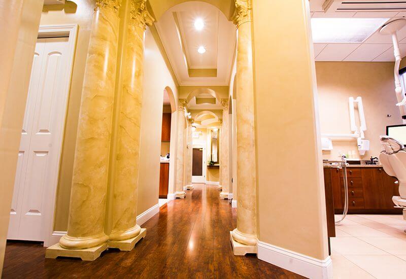 Dental office hallway with yellow walls