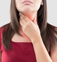 A woman with a sore throat