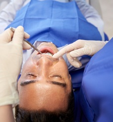 A man receiving a dental exam