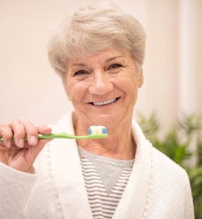 Woman brushing teeth