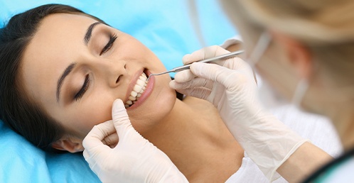 woman getting her teeth scaled