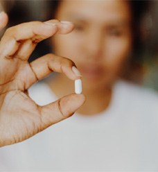 Woman giving thumbs up for sedation dentistry in Jacksonville