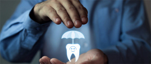 Hologram of tooth with umbrella in between two hands