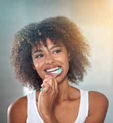 Woman brushing her teeth