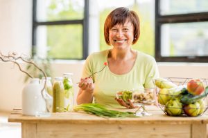 older woman eating lunch