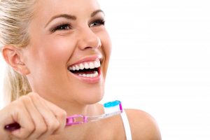 woman brushing teeth