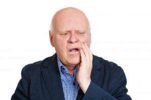 older man with denture problems