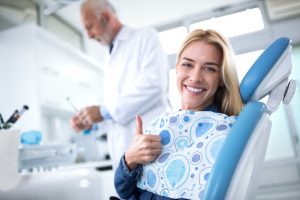 woman smiling in the dental chair