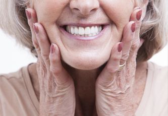 Woman with dentures smiling