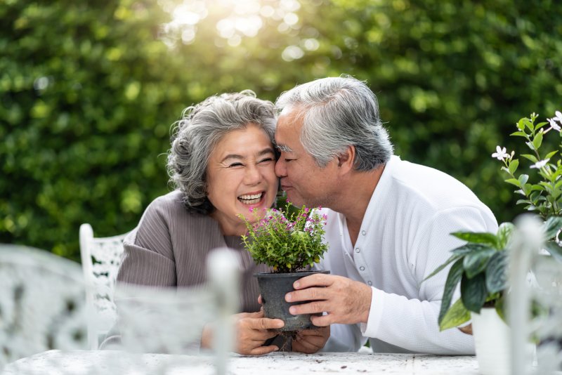 happy couple snuggling outside