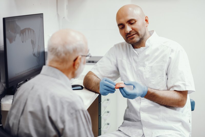 patient learning about dental implants