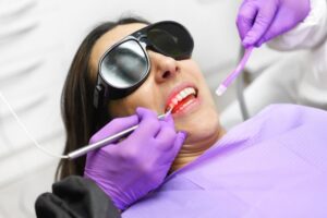 Woman getting laser gum disease treatment