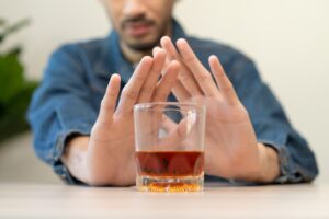 a man saying no to alcohol