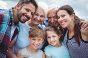 Three generations of a family hugging
