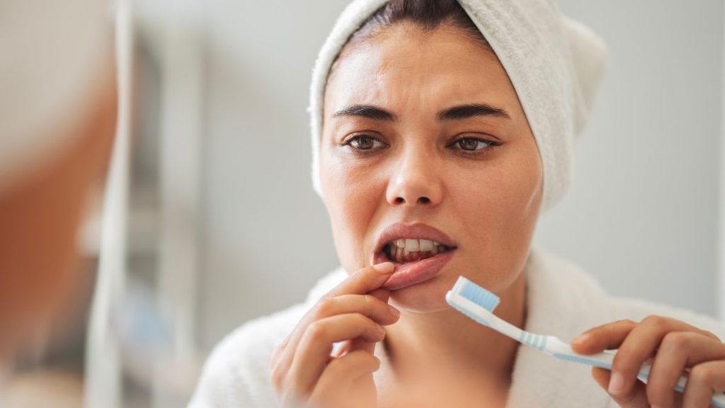 A woman brushing her teeth